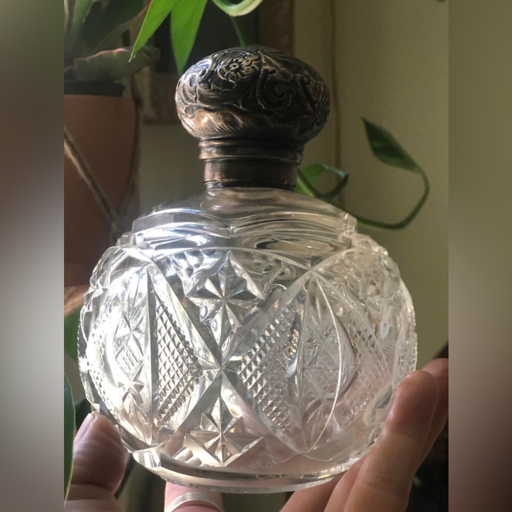 Elegant antique large crystal, sterling silver perfume bottle made in England.